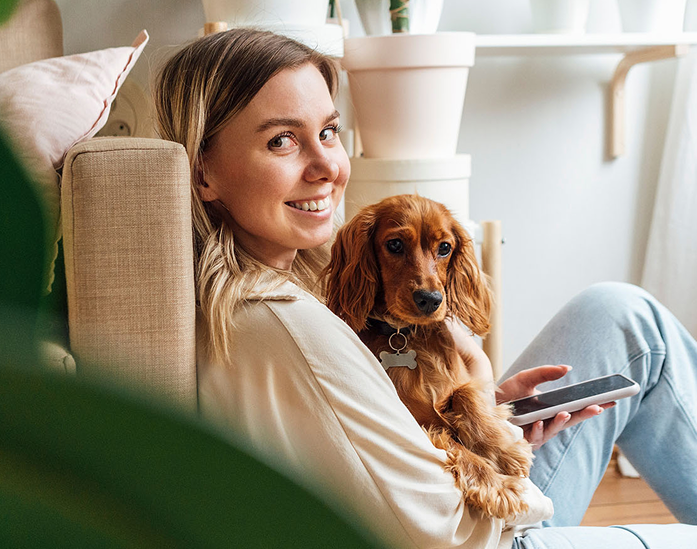 Person with dog on video call