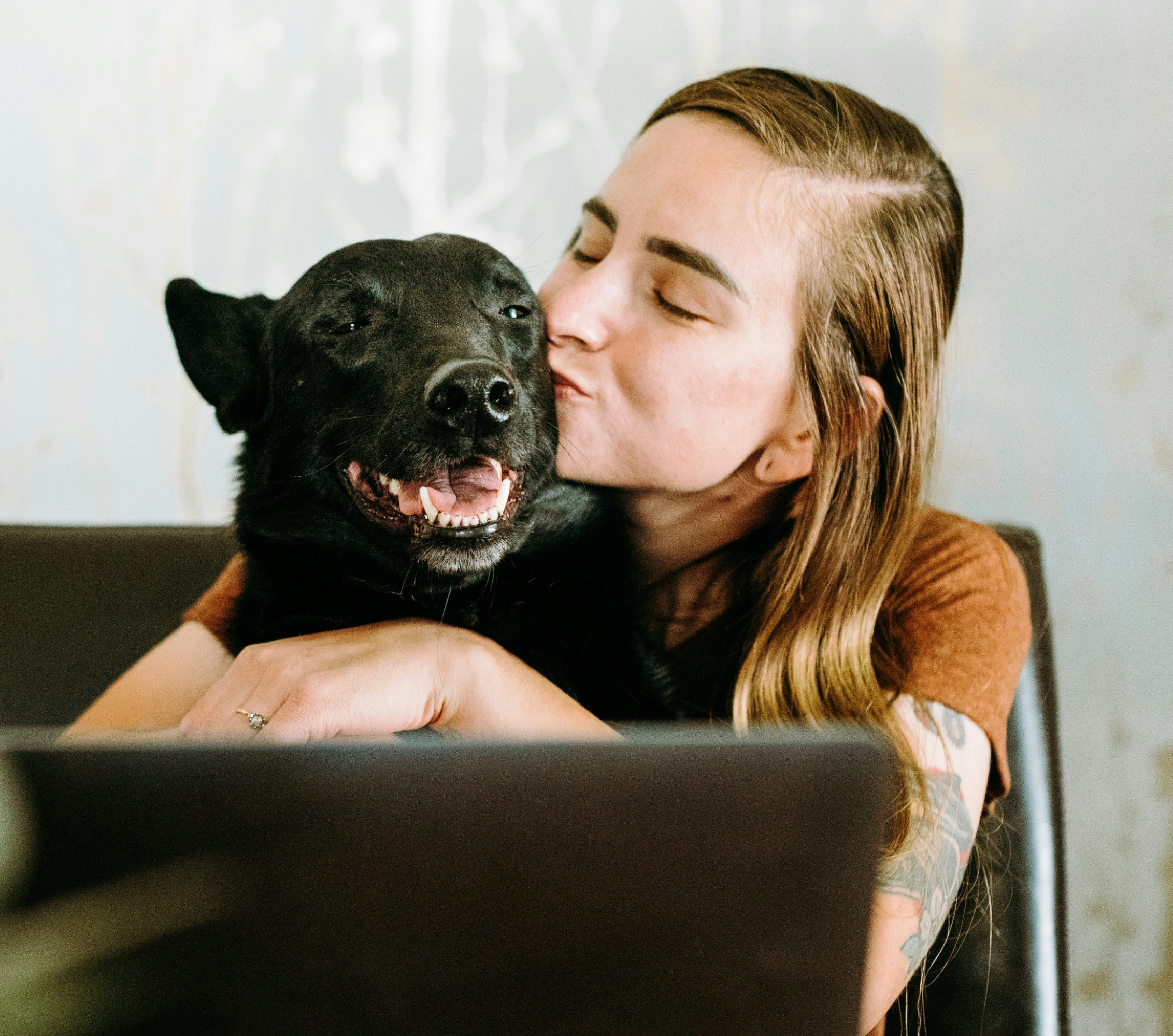 Woman with dog, smiling
